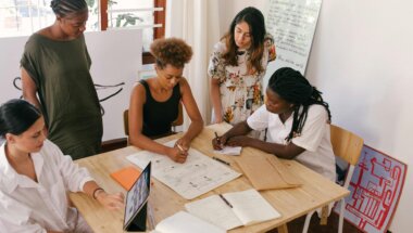 coworkers reviewing data on their high-value user segments.